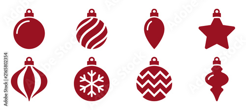 A collection of eight decorative red christmas tree ornaments with various shapes and patterns isolated on a plain white background for design