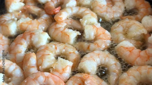 Process frying shrimps on pan, close up