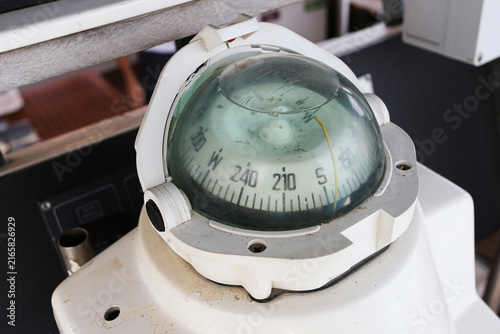 Obraz na plátne Marine compass provides directional navigation instrument