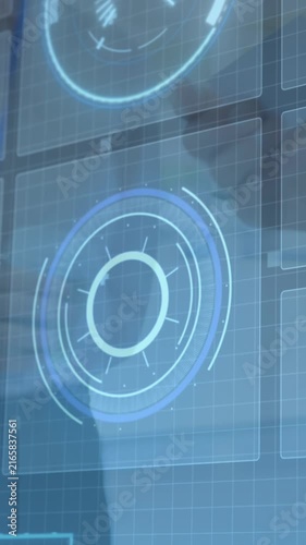 Animation of diverse data on digital screen over businesspeople sharing with business cards