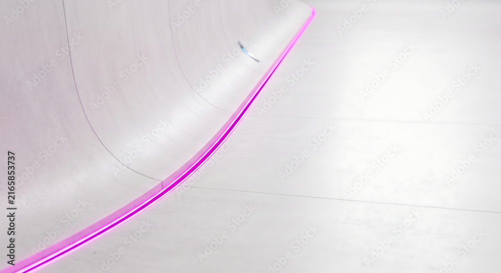 Fototapeta premium Minimalist white skatepark ramp, modern concrete bowl with pink neon light, futuristic urban sports architecture