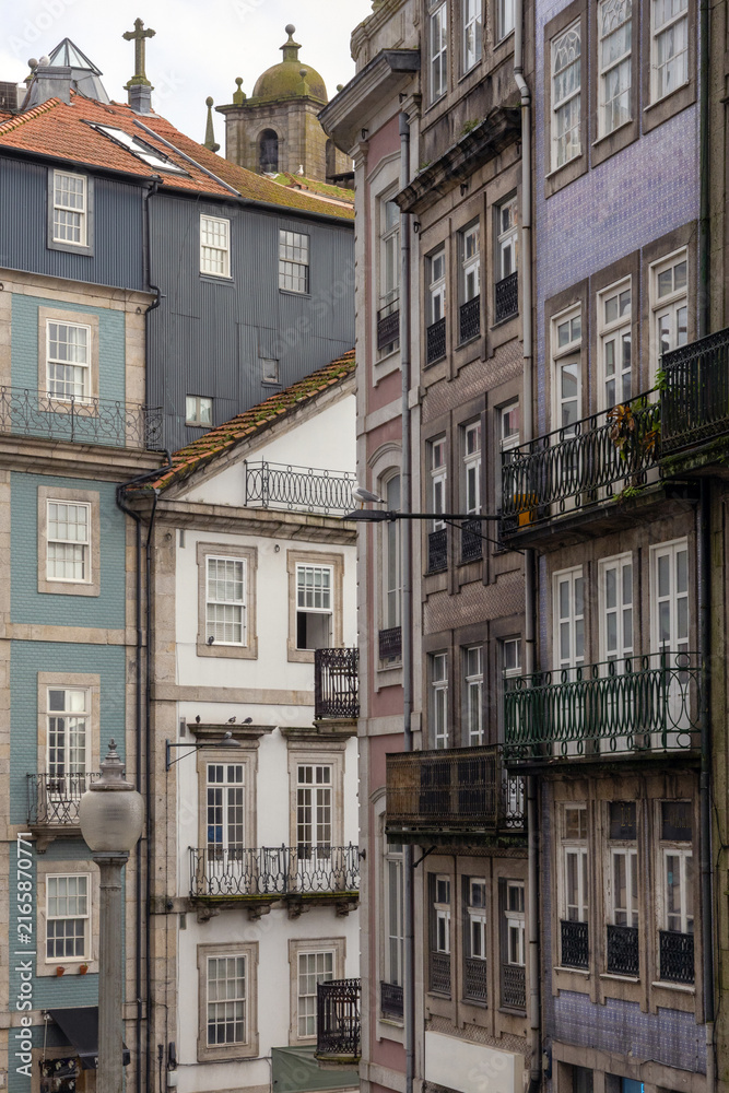 Obraz premium Traditional Portuguese Architecture with Tiled Facades and Balconies