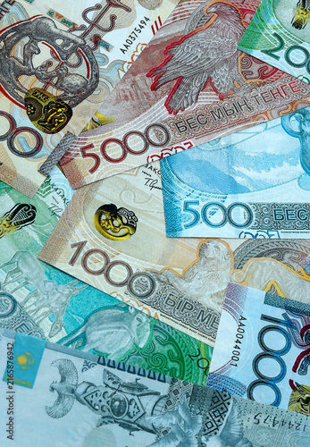 Fotografie Kazakhstani tenge money banknotes pile on table