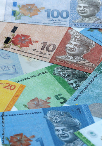 Fotografie Malaysian ringgit money banknotes pile on table