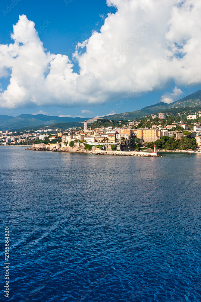 Fototapeta premium The old port of Bastia and the citadel seen from the sea, Haute Corse, Corsican island, France. Leaving Corsica by ferry from Bastia.
