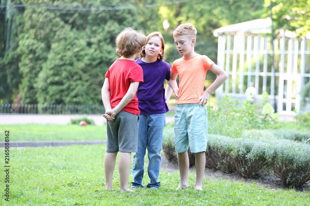 Fototapeta premium Little friends spending time together on green grass outdoors