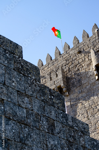 Montalegre castle stone tower with portuguese flag The Concept of national heritage