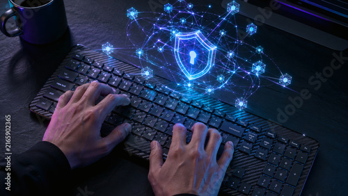 Cybersecurity engineer typing on keyboard with floating 3D post quantum encryption hologram
