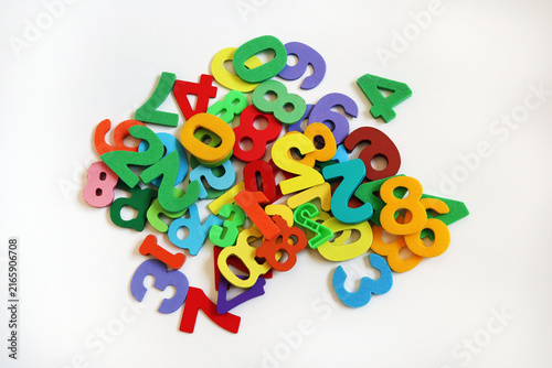 Obraz na płótnie Colorful Foam Numbers Scattered on White Background for Children's Education and