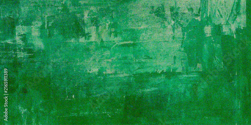 Emerald Abstract Wash A textured abstract background featuring varying shades of deep and light emerald green, with subtle brushstroke textures suggesting a watercolor or painted effect.