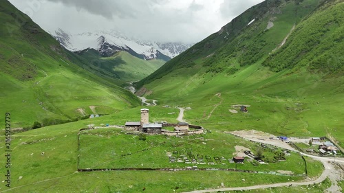 Chapel in Ushguli with Snow Capped Mountains