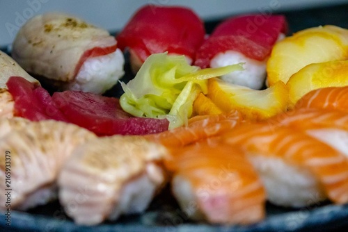 Assorted Nigiri Sushi Platter on Dark Textured Plate