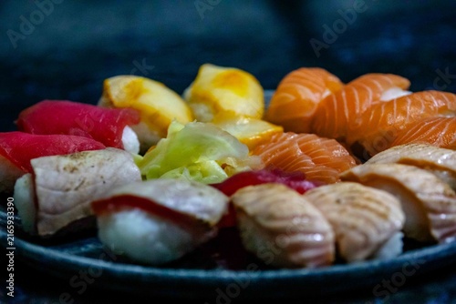 Assorted Nigiri Sushi Platter on Dark Textured Plate