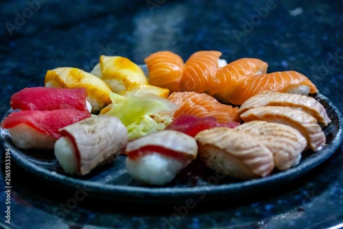 Assorted Nigiri Sushi Platter on Dark Textured Plate