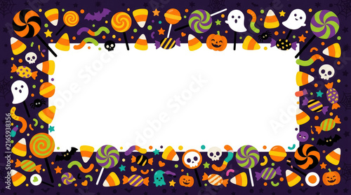Spooky Halloween candy frame with sweets and skulls around white copy space for festive holiday party card