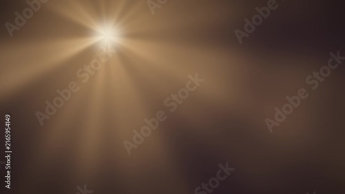 Volumetric light rays radiating god ray beams abstract dark background seamless loop in subtle gold tones