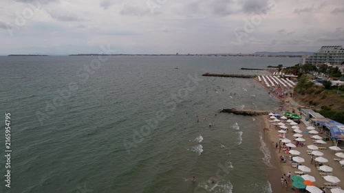 Aerial drone view of houses with red tiles and hotels, sea and beaches of Sveti Vlas in Bulgaria from above, top view from drone. Summer holiday in Europe. Black sea
