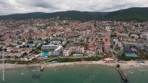 Aerial drone view of houses with red tiles and hotels, sea and beaches of Sveti Vlas in Bulgaria from above, top view from drone. Summer holiday in Europe. Black sea
