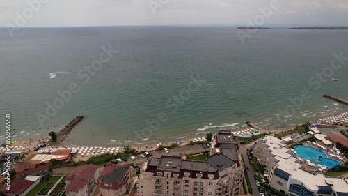 Panoramic aerial view of houses and hotels with pool, residential apartment, sea and beaches of Sveti Vlas in Bulgaria from above, top view from drone. Summer holiday in Europe. 
