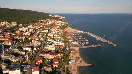 Marina port in Sveti Vlas. Panoramic aerial view of houses and hotels, sea and beaches of Sveti Vlas in Bulgaria from above, top view from drone. Summer holiday in Europe. 
