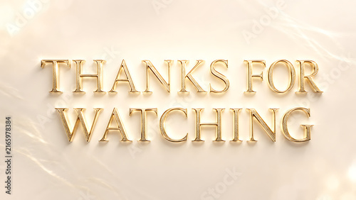 Golden 3D letters spelling thanks for watching on a light beige background.