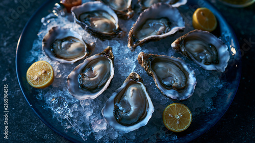 Fresh Raw Oysters on Crushed Ice with Lemon Slices