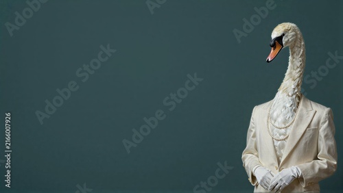 Elegant swan in a cream suit and pearls, poised against a deep green backdrop.