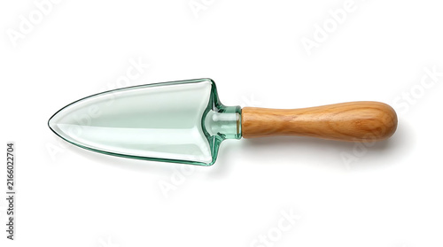 Close up of elegant clear green glass gardening trowel with wooden handle on pure white background for modern botanical and indoor plant care concepts