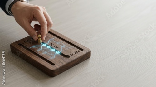 Hand touching wooden button depicting ai task planning as converting goals into smaller executable steps for action