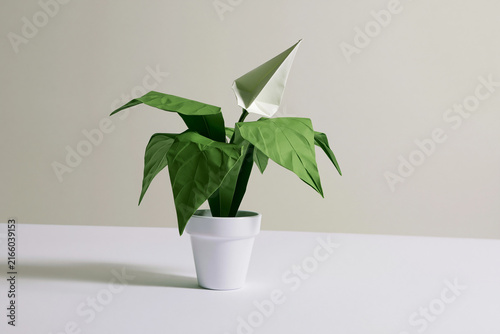 Potted plant folded from paper surreal origami craft concept