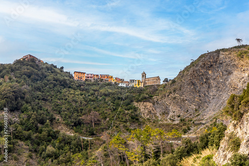 Фотография San Bernardino village perched on mountain ridge above Corniglia in Cinque Terre