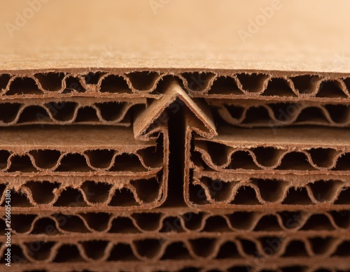 Corrugated Cardboard Cross-Section Revealing Wavy Structure Forming Arrow Pattern, Symbolizing Business Growth and Progress