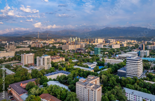 A picturesque drone view of the Kazakh city of Almaty at sunset on a summer evening.
