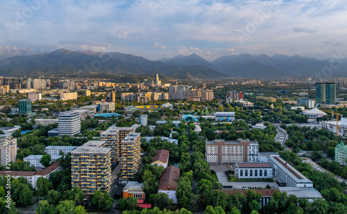 A picturesque drone view of the Kazakh city of Almaty at sunset on a summer evening.