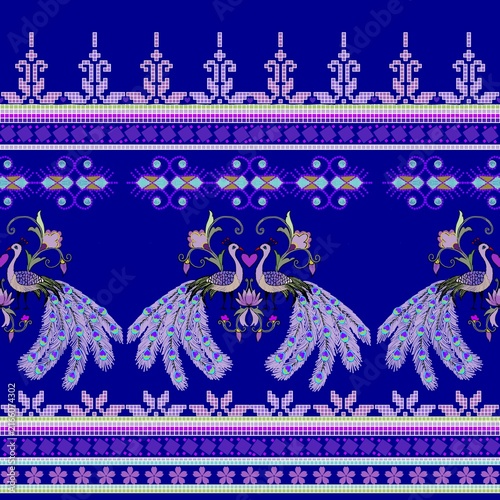Striking seamless border pattern with fusion style motifs and applied art design featuring peacocks on a royal blue background.