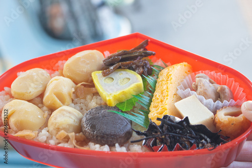 Fotografie Top down view of a seasonal obento - Japanese traditional lunch box