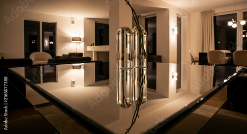 Contemporary home interior with barbell and dumbbells on wooden floor in luxury indoor living room