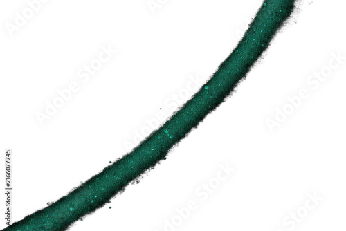 Abstract glowing green dust particle trail on black background