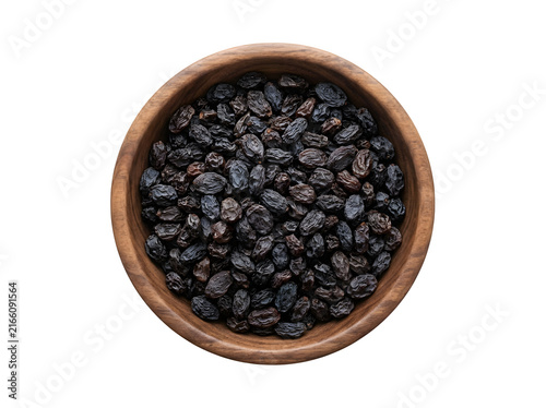 Top view of dark raisins in a wooden bowl isolated on transparent background