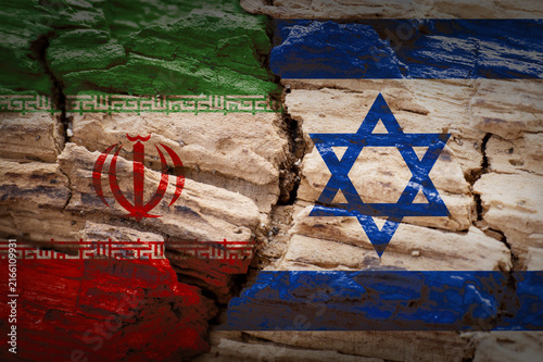 Iran and Israel flags on cracked wood texture symbolizing geopolitical conflict and tension.