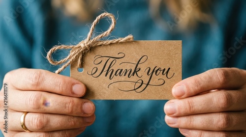 Hands Holding Rustic Thank You Kraft Tag