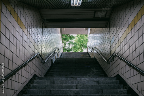 Underground pedestrian tunnel stairs leading to daylight