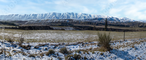 Mountain ridge covered in snow and snow on the ground in Central Otago