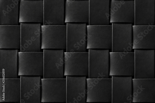 Фотография Black woven texture with interlocking rectangular panels and subtle dimensional depth