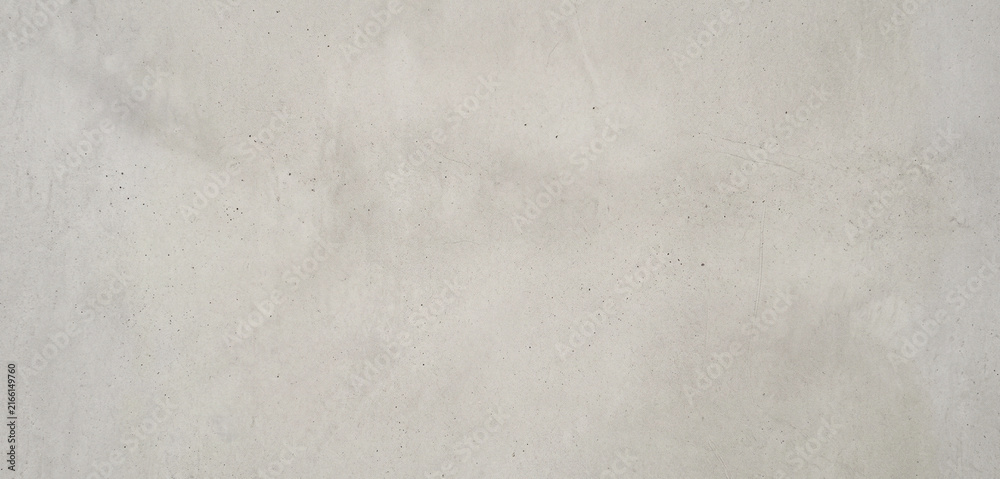 Naklejka premium A smooth, light gray surface of concrete displaying a subtle texture, ideal for backgrounds or architectural designs in various projects.