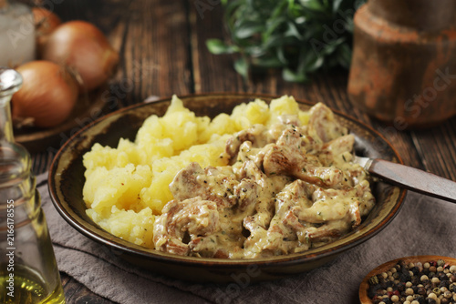 Mashed potatoes served with traditional German chanterelle cream sauce	