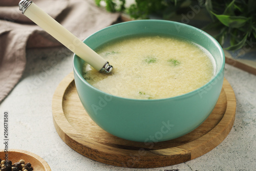 A bowl with traditional Italian cheese and egg soup Stracciatella