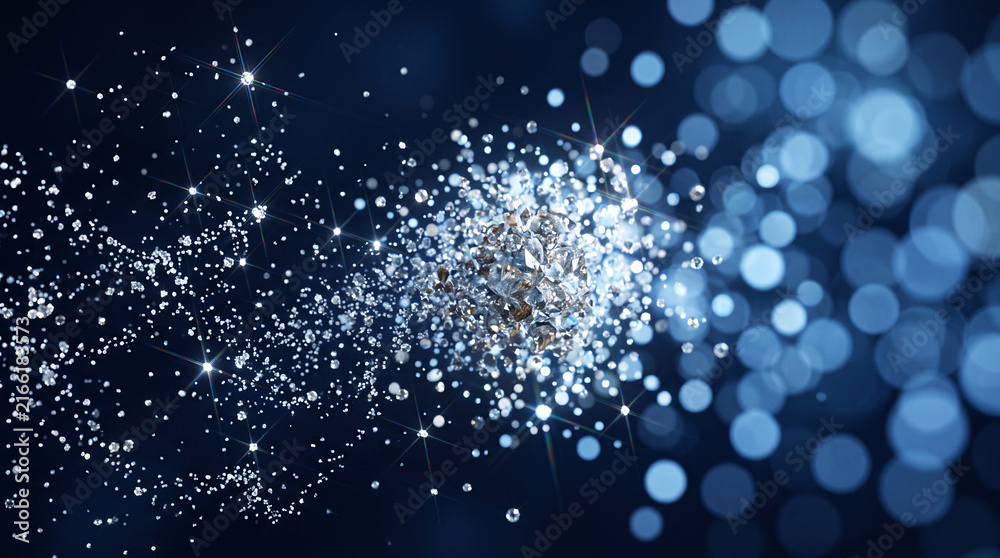 Obraz premium Explosion de particules brillantes argentées sur fond bleu