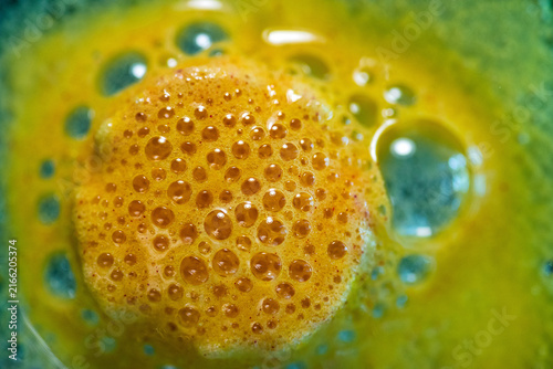 Konstfotografi Detailed view of green and yellow bubbling chemical reactive liquid glaze