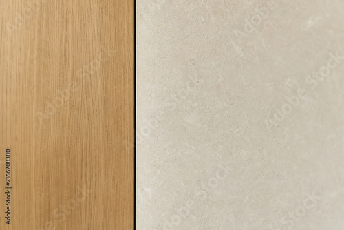 Natural wood and stone junction in premium architectural close-up illustrating contemporary interior materials and craftsmanship